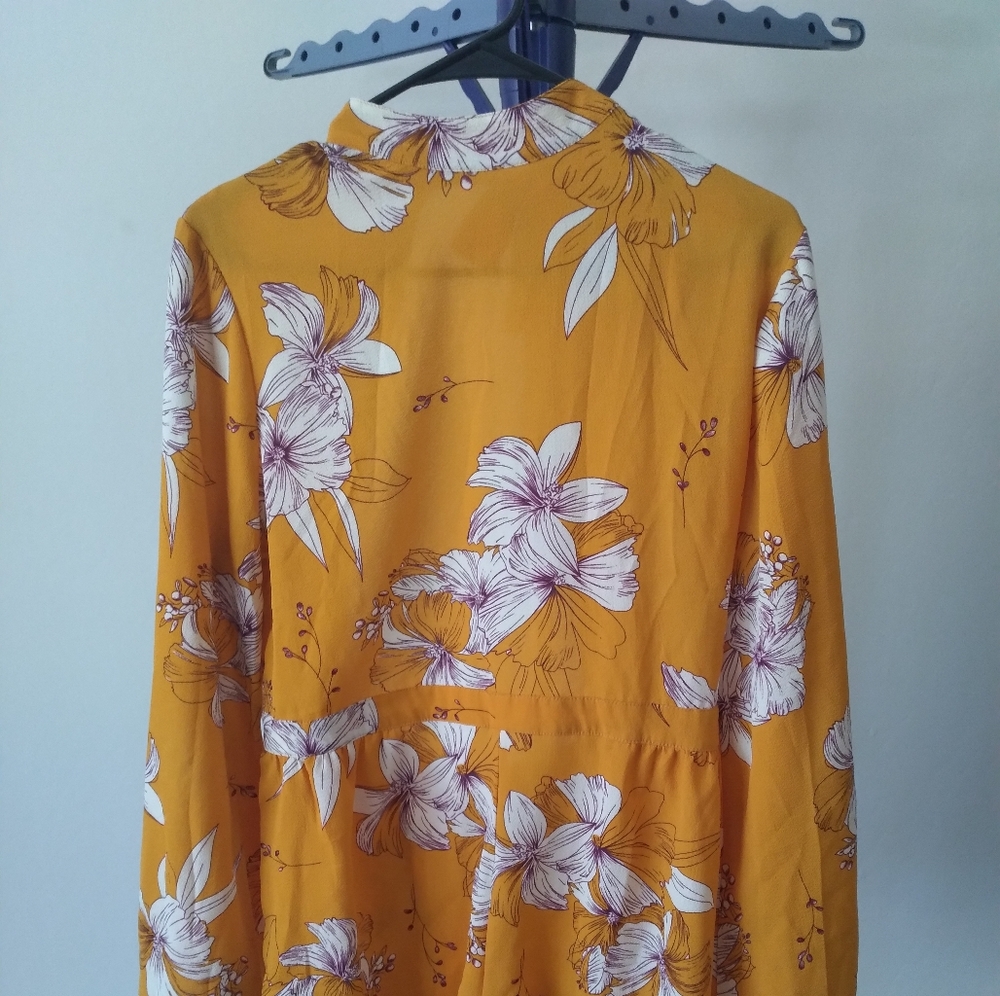 Yellow romper with white flowers